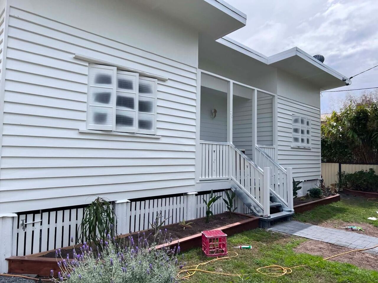 Repainted classic white Queenslander home in Brisbane